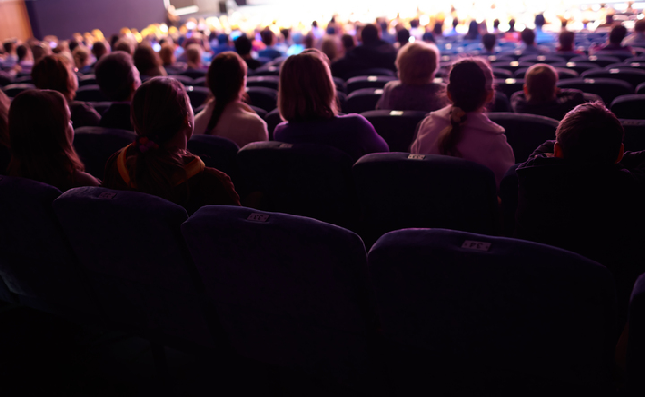Comedian making audience laugh